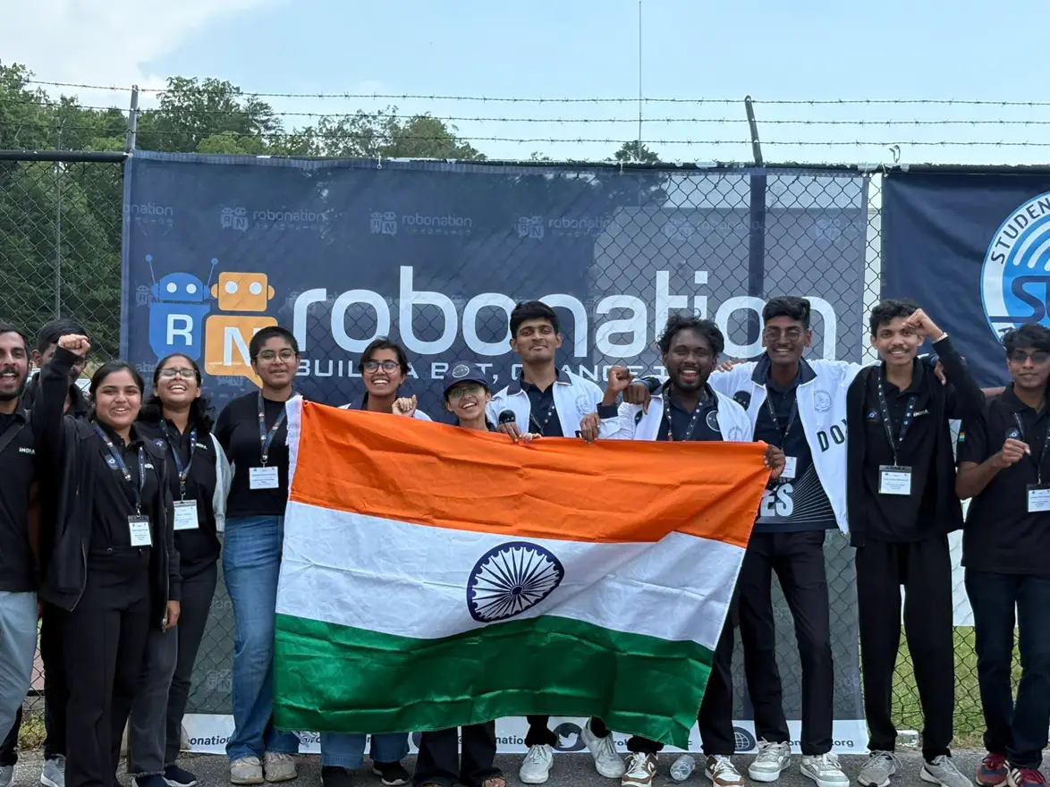 Team IIT Madras with the Indian flag at the RoboNation banner, SUAS 2025, Maryland